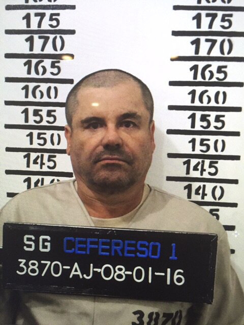 In this Jan. 8, 2016 image released by Mexico's federal government, Mexico's most wanted drug lord, Joaquin "El Chapo" Guzman, stands for his prison mug shot with the inmate number 3870 at the Altiplano maximum security federal prison in Almoloya, Mexico. (Mexico's federal government via AP)