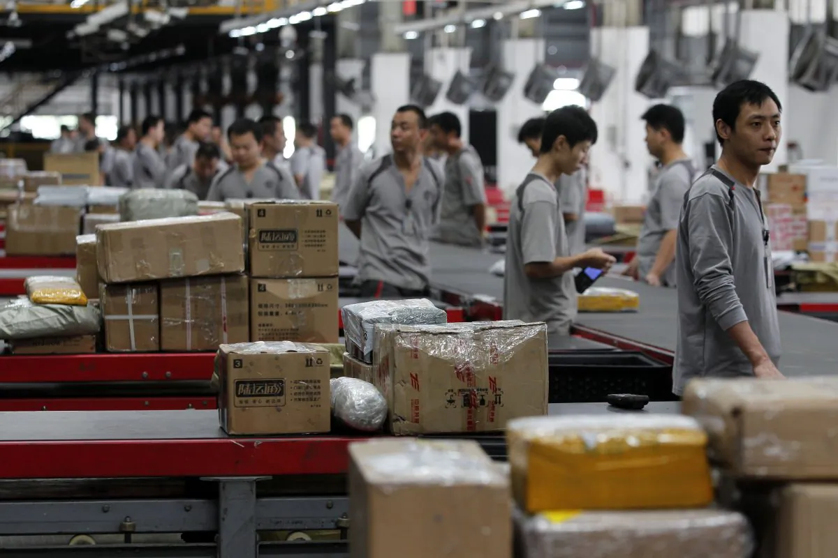 Workers distribute parcels at S.F. Express in Shenzhen, China on on November 11, 2013. (ChinaFotoPress/ChinaFotoPress via Getty Images)