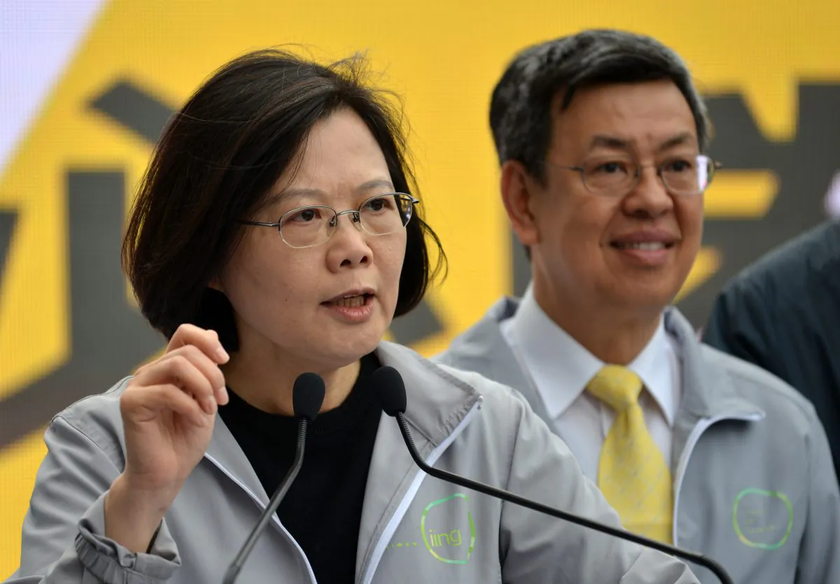 Tsai Ing-wen (L), chairwoman from Taiwan's main opposition Democratic Progressive Party (DPP) and the party's candidate for in the Jan. 2016 presidential election, speaks to supporters next to running mate Chen Chien-jen (R) during a campaign fundraiser in Taipei on Dec. 20, 2015. About 1,000 supporters gathered at the fundraiser for Taiwan's main opposition party as the month-long presidential election campaign period kicked off. (Sam Yeh/AFP/Getty Images)