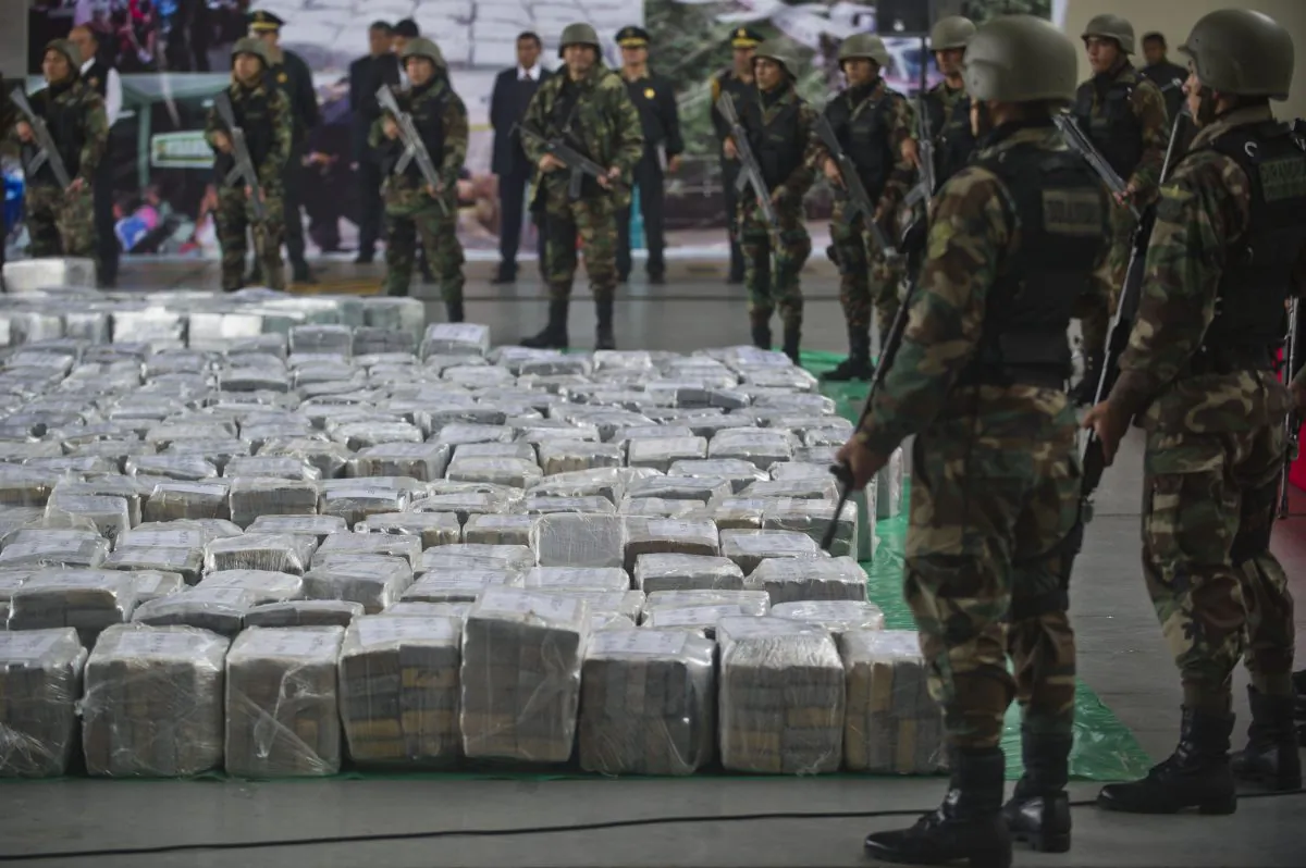 Police officers during the arrival of more than 7 tons of cocaine at the police airport in Lima on Sept. 1, 2014. (Ernesto Benavides/AFP/Getty Images)
