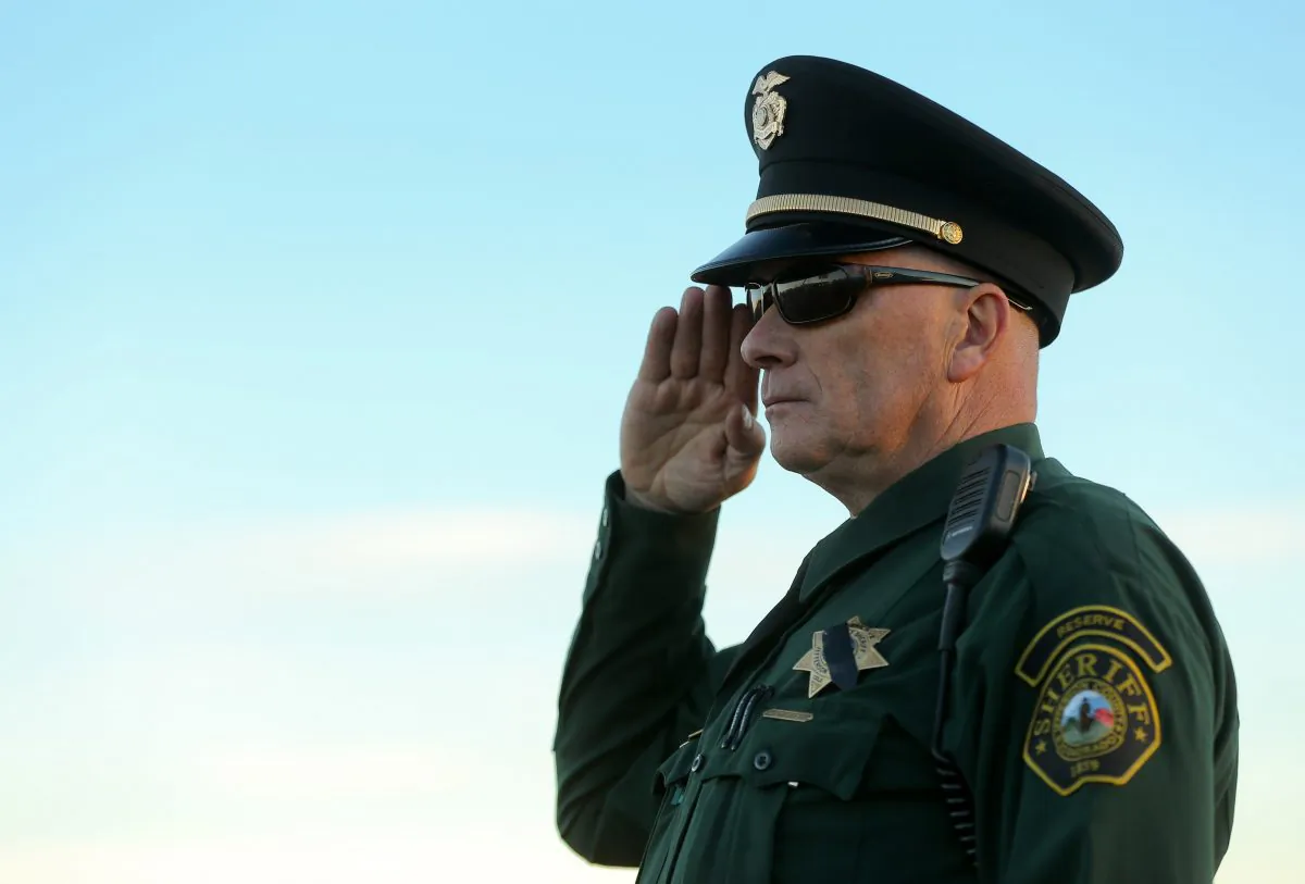 An officer salutes following funeral services for police officer Garrett Swasey at New Life Church in Colorado Springs, Colo., on Dec. 4, 2015. Swasey was killed in the line of duty on Nov. 27 when a gunman opened fire at a Planned Parenthood clinic. (Justin Edmonds/Getty Images)