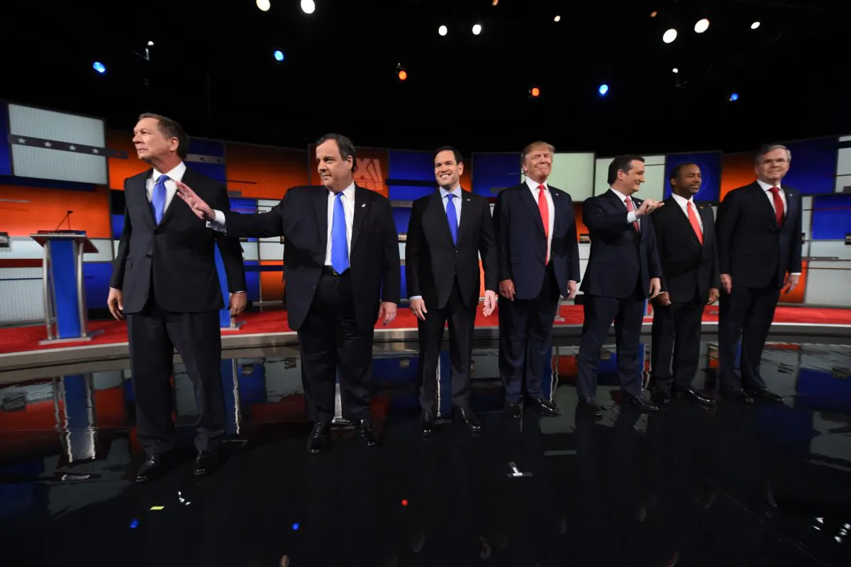 Former Presidential candidates Ohio Gov. John Kasich, New Jersey Gov. Chris Christie, Florida Senator Marco Rubio, businessman Donald Trump, Texas Senator Ted Cruz, retired neurosurgeon Ben Carson, and former Florida Gov. Jeb Bush arrive on stage before the Republican Presidential debate in Charleston, South Carolina on Jan.14, 2016. (Timothy A. Clary/AFP/Getty Images)
