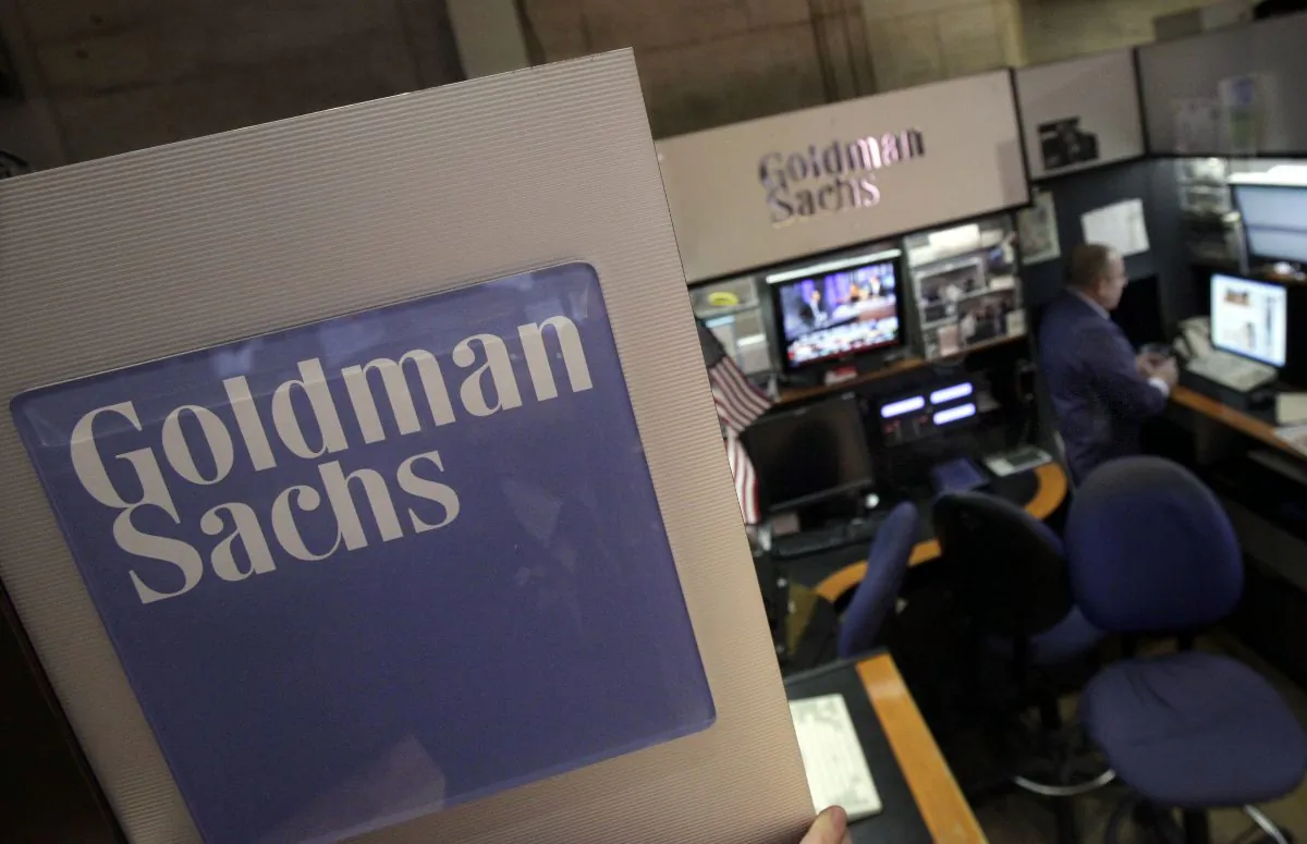 A trader works in the Goldman Sachs booth on the floor of the New York Stock Exchange, in this file photo. (AP Photo/Richard Drew, File)