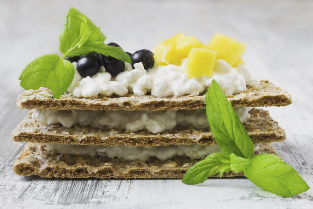 rye bread with cottage cheese mango and berries of mountain ash
