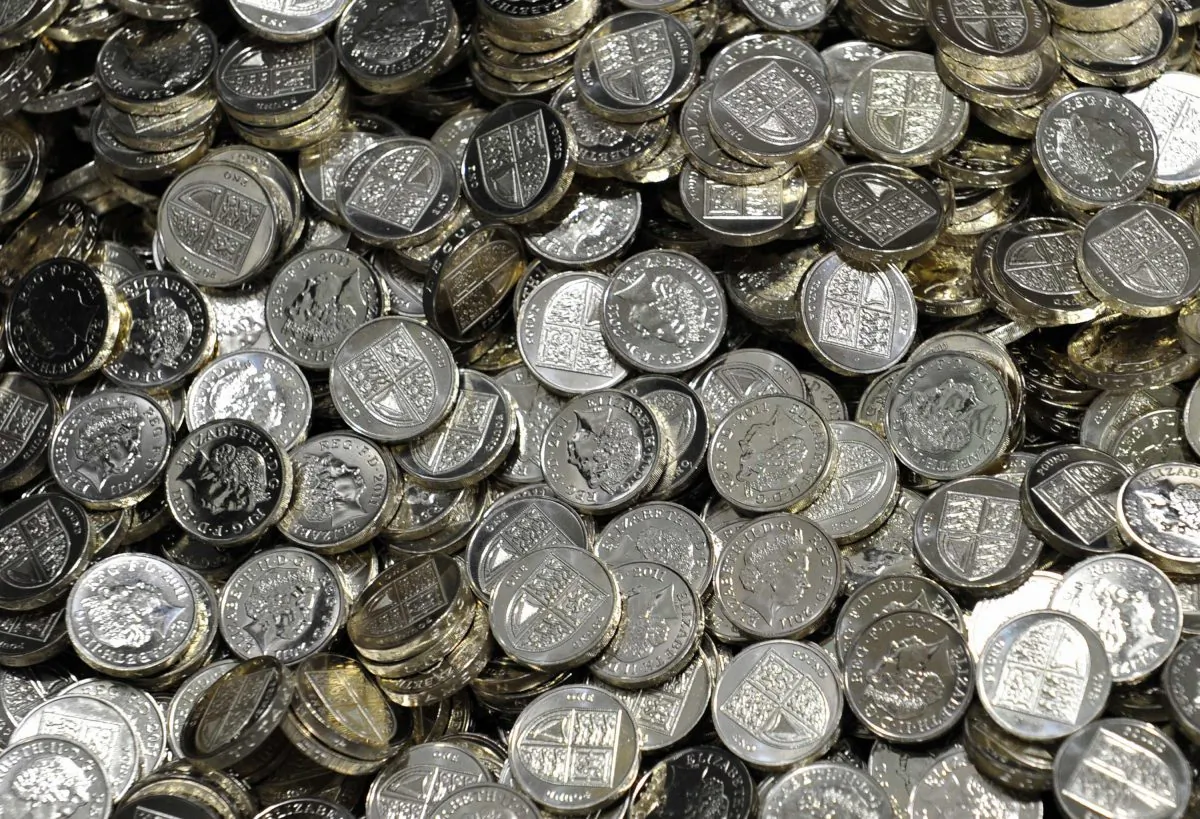 Newly minted one pound coins are seen at the Royal Mint, in Cardiff March 5, 2011. (Toby Melville - WPA Pool/Getty Images)