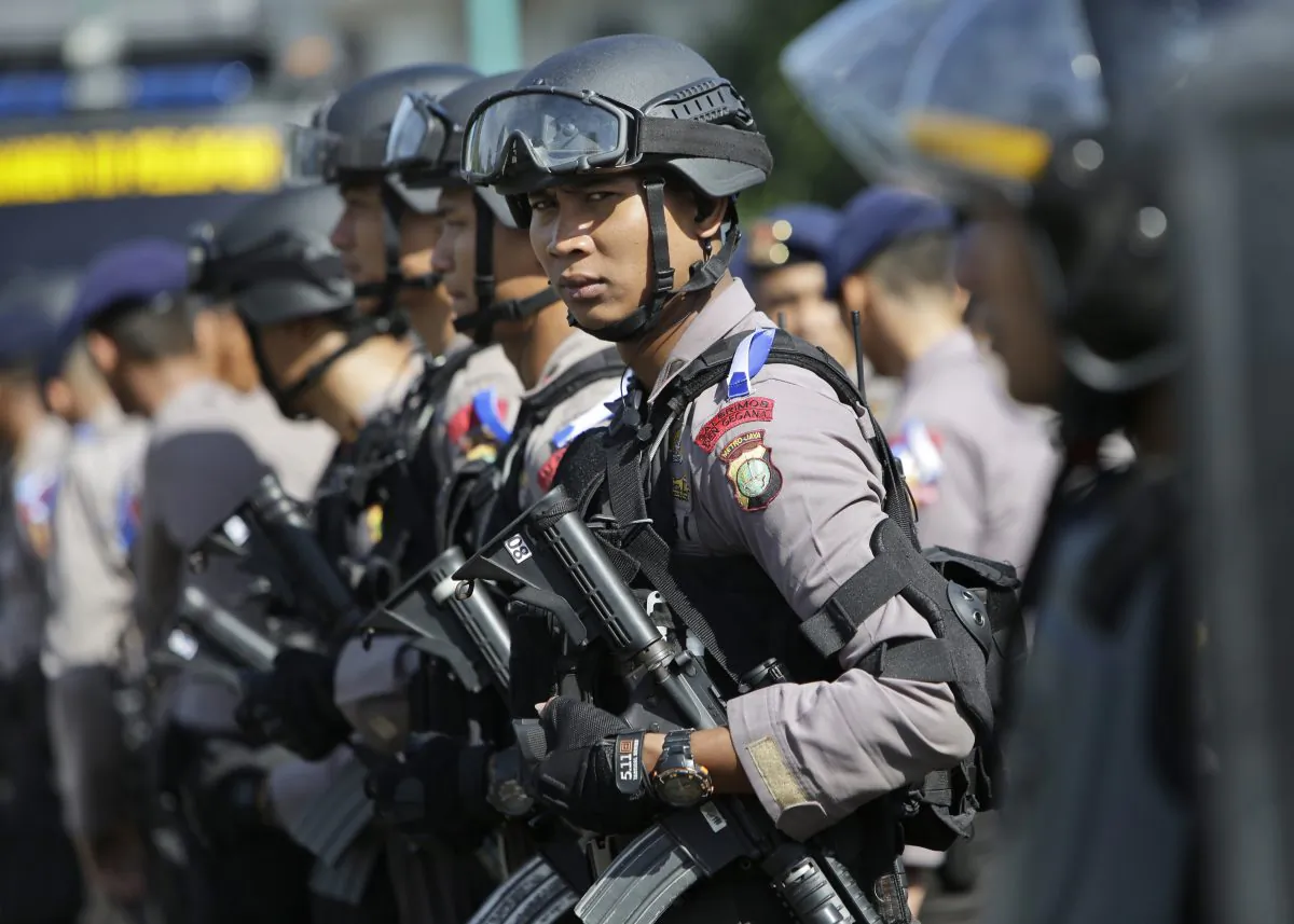 Indonesian police officers deploy with their riot gear in Jakarta, Indonesia, Wednesday, Dec. 23, 2015. (AP Photo/Tatan Syuflana)