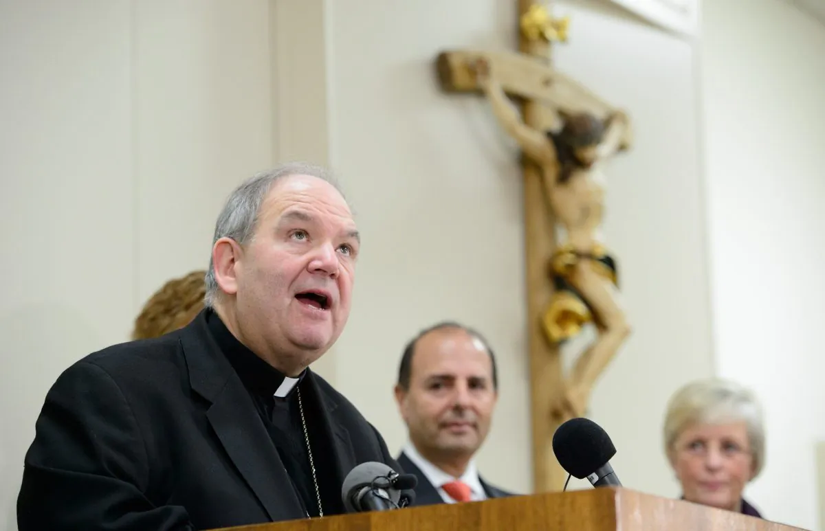 Archbishop Bernard Hebda speaks about the settlement reached between Ramsey County prosecutors and the Archdiocese of St. Paul and Minneapolis at a news conference in St. Paul, Minn., on Dec. 18, 2015. The Archdiocese of St. Paul and Minneapolis reached a settlement with Ramsey County prosecutors in a civil case that alleges it failed to protect children from sexual abuse. A criminal case that accuses church leaders of repeatedly ignoring misconduct by a former priest is ongoing. (Glen Stubbe/Star Tribune via AP)