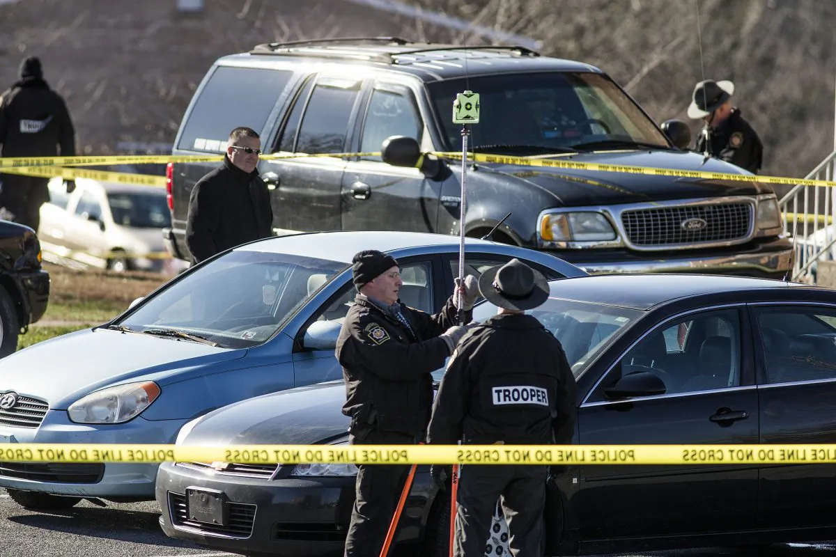 In this Monday, Jan. 11, 2016 photo, State police investigate the scene of a deadly shooting at Pfautz Rentals apartments in Penn Township, Pa. Authorities said a 12-year-old girl was shot and killed during a confrontation between her father and a state constable serving an eviction order at their central Pennsylvania apartment. (Dan Gleiter/PennLive.com via AP)