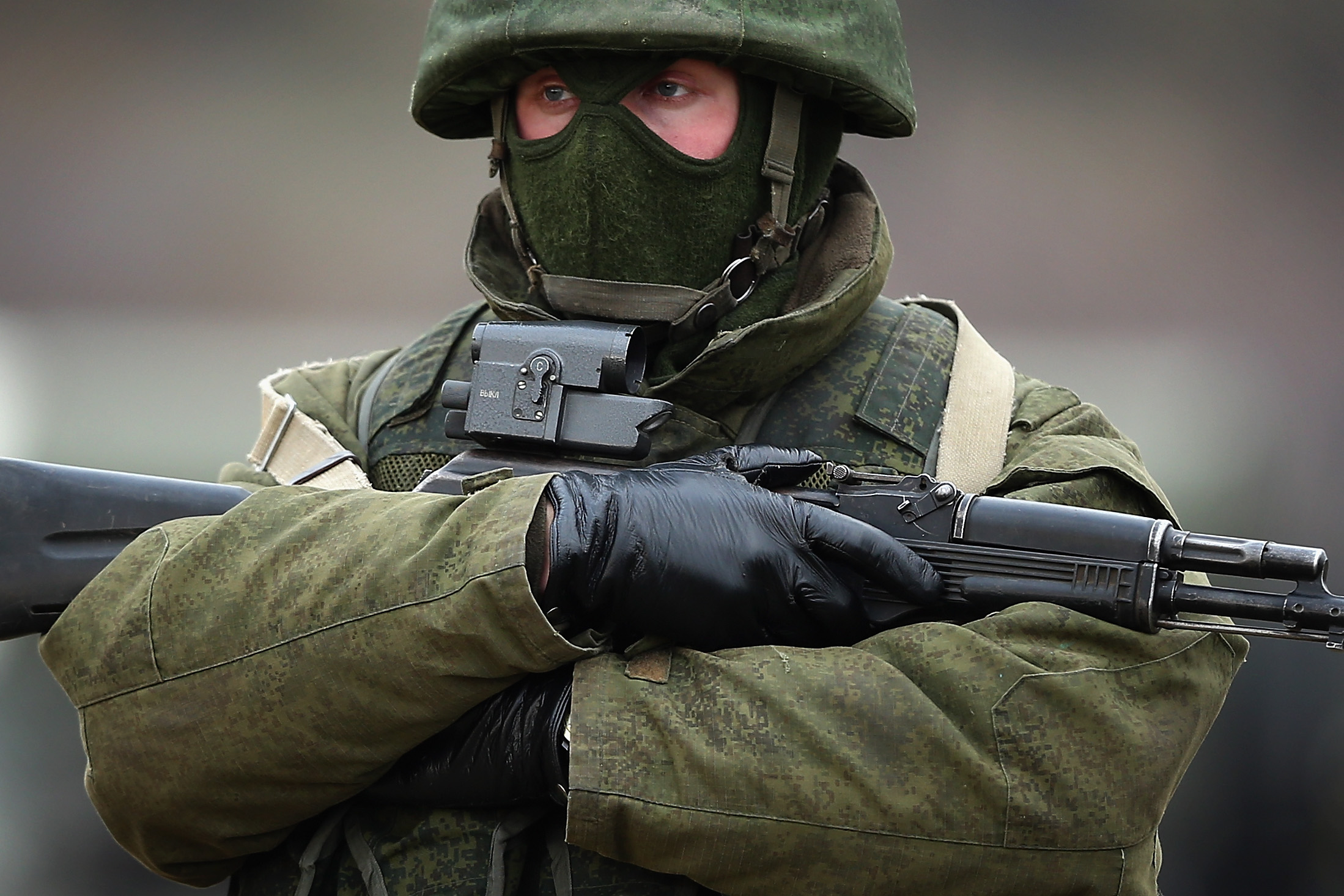 Armed men believed to be Russian military patrol outside a Ukrainian military base in Simferopol, Ukraine, on March 12, 2014. (Dan Kitwood/Getty Images)