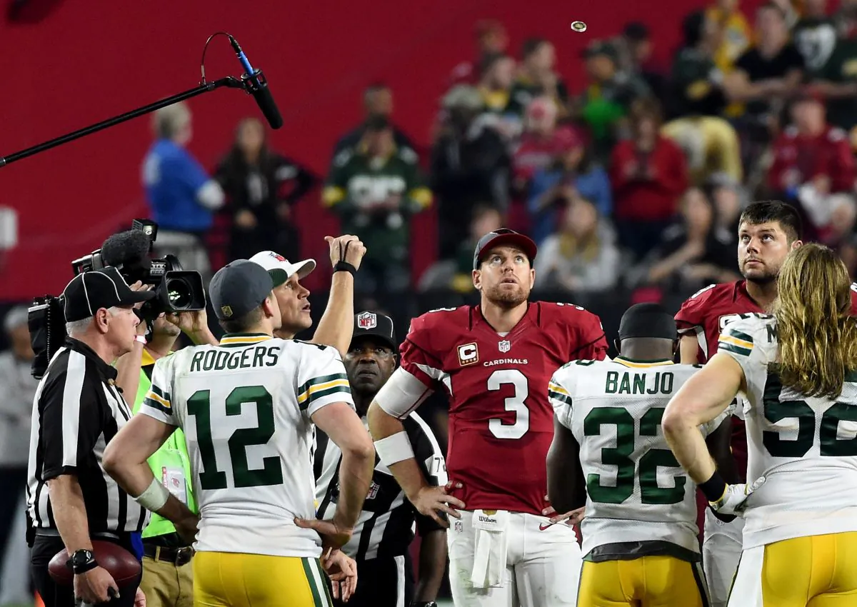 The coin toss to determine possession is maybe the most important part of an NFL overtime period. (Norm Hall/Getty Images) 