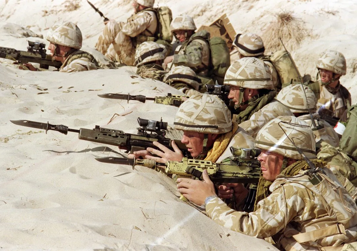 British soldiers from the First Stafford, also known as the "Desert Rats," stand in a trench somewhere in Saudi desert, ready to attack during a live ammunition exercise, featuring the capture of an Iraqi positions, on Jan. 6, 1991. (Patrick Baz/AFP/Getty Images)