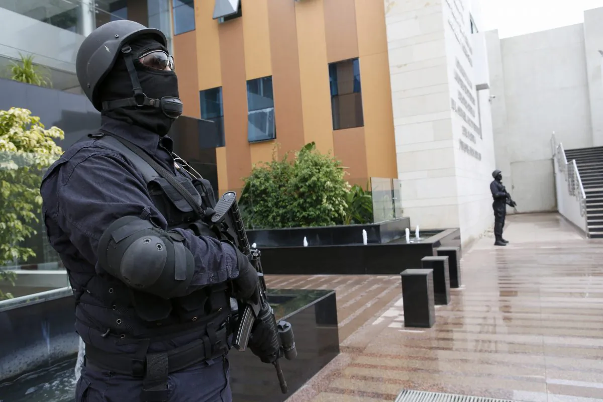 Members of the Moroccan special anti-terror unit guard the headquarters of the Central Bureau of Judicial Investigations in Sale near Rabat, Morocco, Tuesday, Jan. 5, 2016. (AP Photo/Abdeljalil Bounhar)
