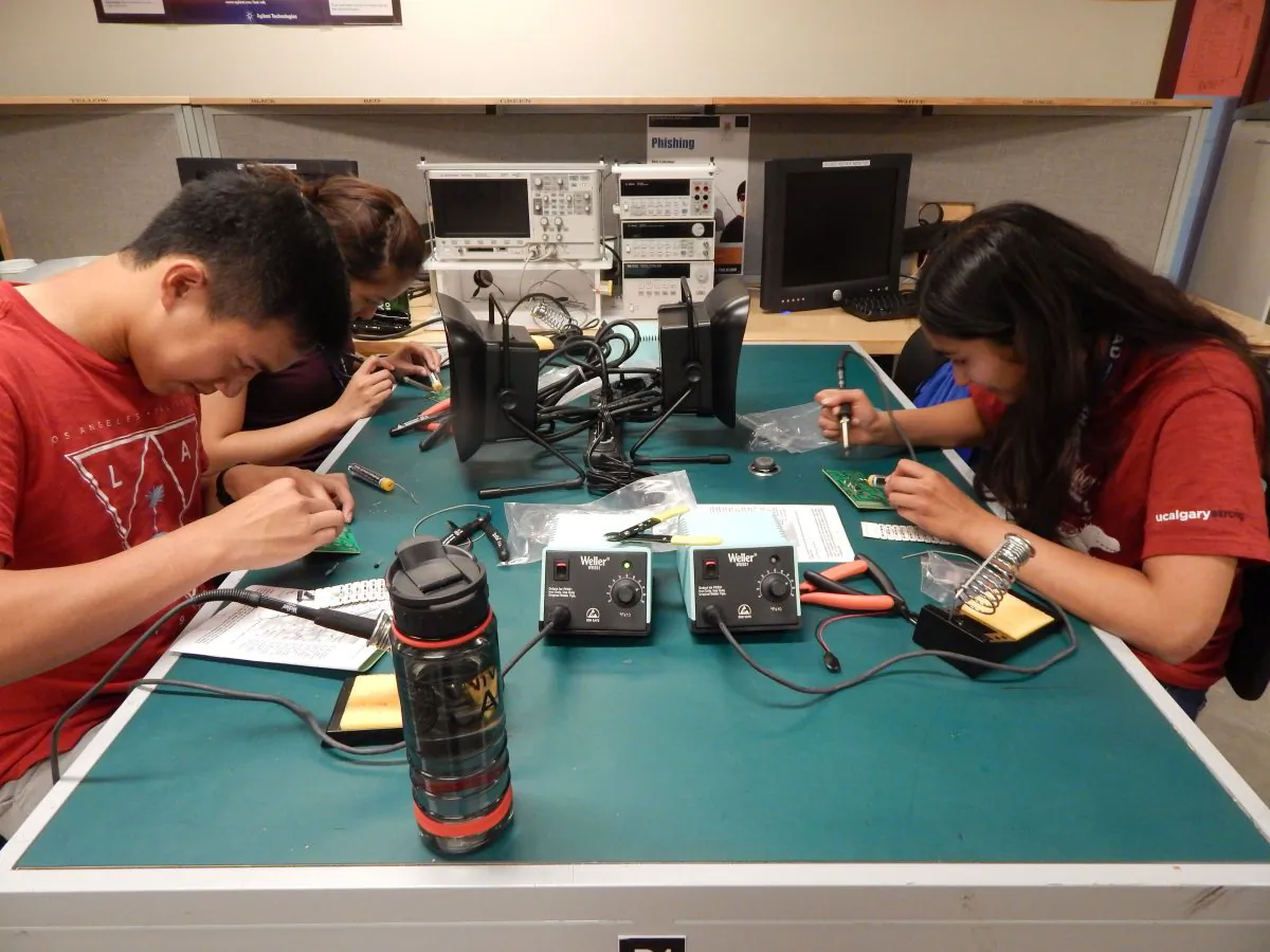SHAD students at the University of Calgary soldering electronic parts. Thirty participants in the SHAD program have gone on to become Rhodes Scholars. (Courtesy of SHAD)