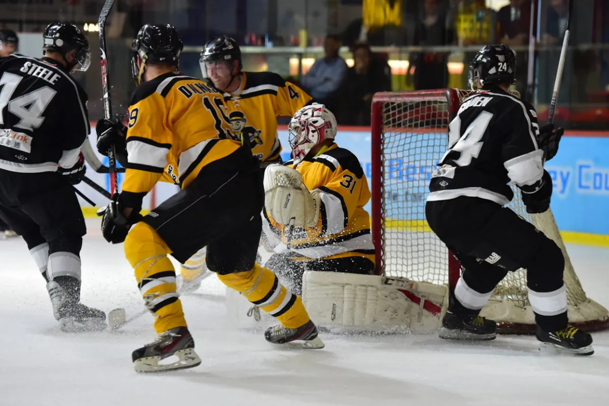 Goalmouth action in the match between South China Sharks and Hong Kong Tycoons in the CIHL in Hong Kong on Thursday Jan 14, 2016. Tycoons scooped an 8-6 win by pulling out 2-goals late in the 3rd session. (Cox/Epoch Times)