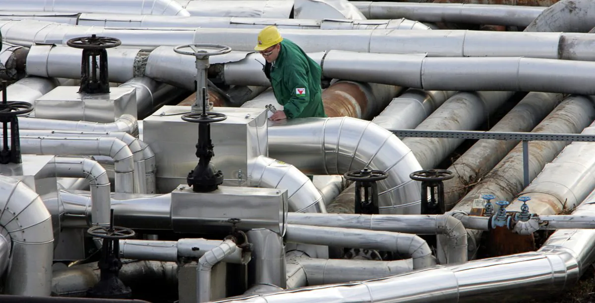 An engineer checks the refinery plant at the receiving station of the oil pipeline Druzhba in Szazhalombatta, some 30 kms south of Budapest, Hungary, on Jan. 9, 2007. (Attila Kisbenedek/AFP/Getty Images)