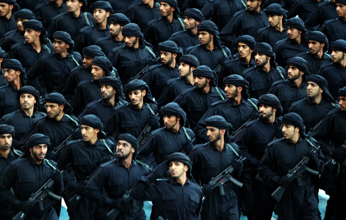 Emirati troops march during celebrations marking the 40th anniversary of the establishment of the United Arab Emirates at Sheikh Zayed Sports City in Abu Dhabi on December 2, 2011. (Photo credit should read KARIM SAHIB/AFP/Getty Images)
