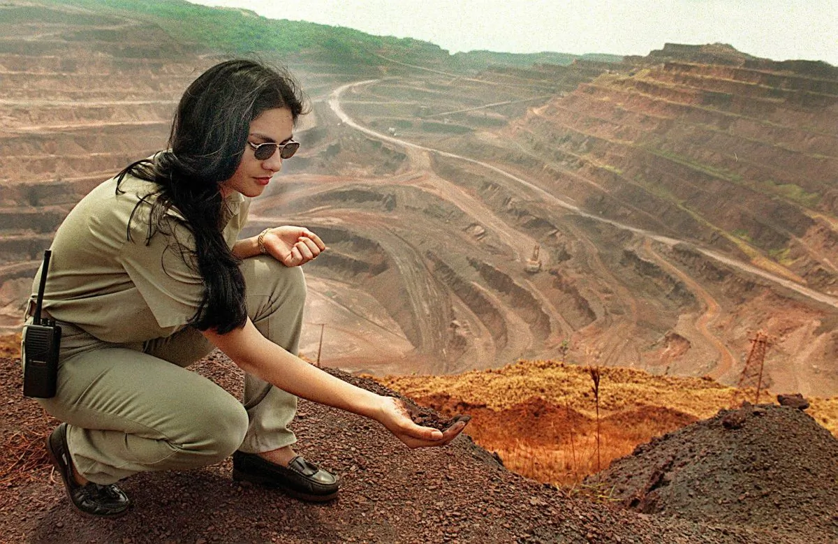 An employee at the Vale do Rio Doce mining company shows iron deposit at the strip mine of Carajas, in the heart of the Amazon Forest in northern Brazil, on Aug. 30, 1999. Carajas is the largest iron ore mine in the world, and also exploits gold, manganese, copper, and nickel. (Vanderlei Almeida/AFP/Getty Images)