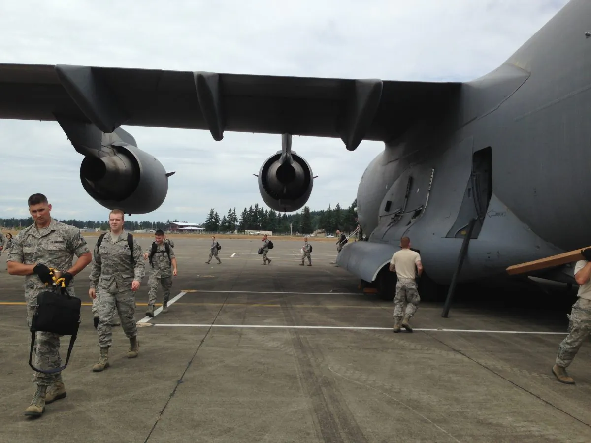 In this June 18, 2015, photo provided by the Washington State Army National Guard, airmen from the 242nd Combat Communications Squadron at Fairchild Air Force Base exit and unload a C-17 flown by the 446th Airlift Wing at Gray Army Airfield at Joint Base Lewis-McChord as part of Exercise Evergreen Tremor, a rehearsal of the emergency management and military response in the event of a catastrophic Cascadia Subduction Zone earthquake.  (2nd Lt. Hans Zeiger/Washington State Army National Guard via AP)