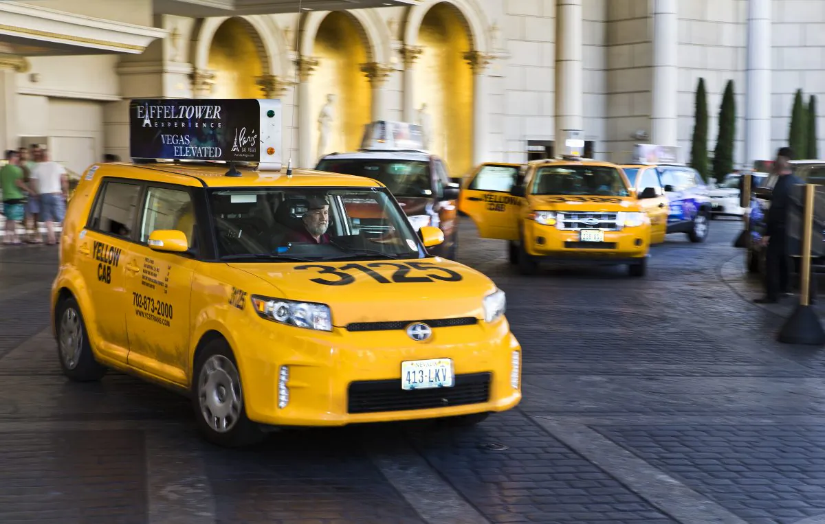Taxi cabs operate at Caesars Palace on May 29, 2015.  (LE Baskow/Las Vegas Sun via AP)