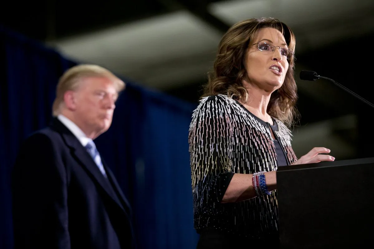 Former Alaska Gov. Sarah Palin, right, endorses Republican presidential candidate Donald Trump during a rally at the Iowa State University, Tuesday, Jan. 19, 2016, in Ames, Iowa. (AP Photo/Mary Altaffer)