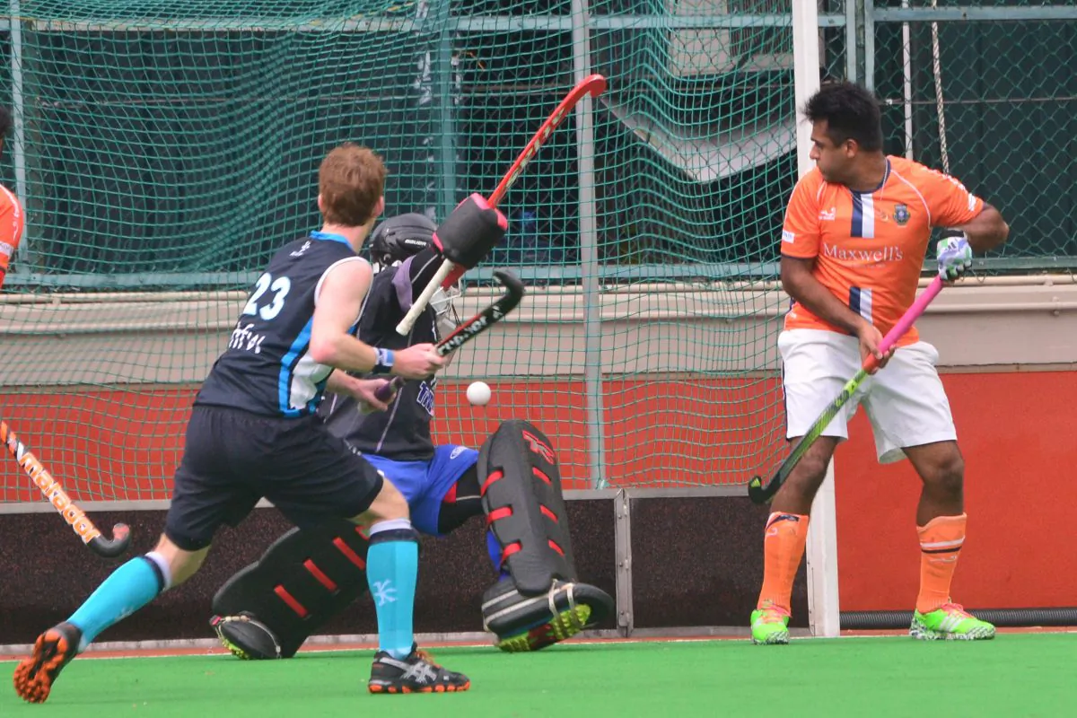 Deflector: Khalsa player/coach Arif Ali can only watch in dismay as Club reduce their 2-0 lead through a Gabriel Tsoi penalty corner, in their HK Premier Division match at HKFC on Sunday Jan 17, 2016. (Eddie So)