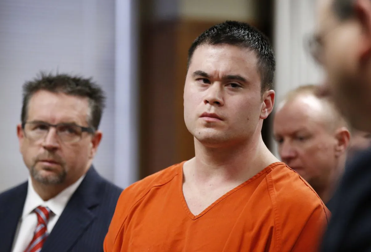 Daniel Holtzclaw, center, listens as Gayland Gieger, right, Oklahoma County assistant district attorney, speaks during Holtzclaw's sentencing hearing in Oklahoma City, Thursday, Jan. 21, 2016. (AP Photo/Sue Ogrocki)