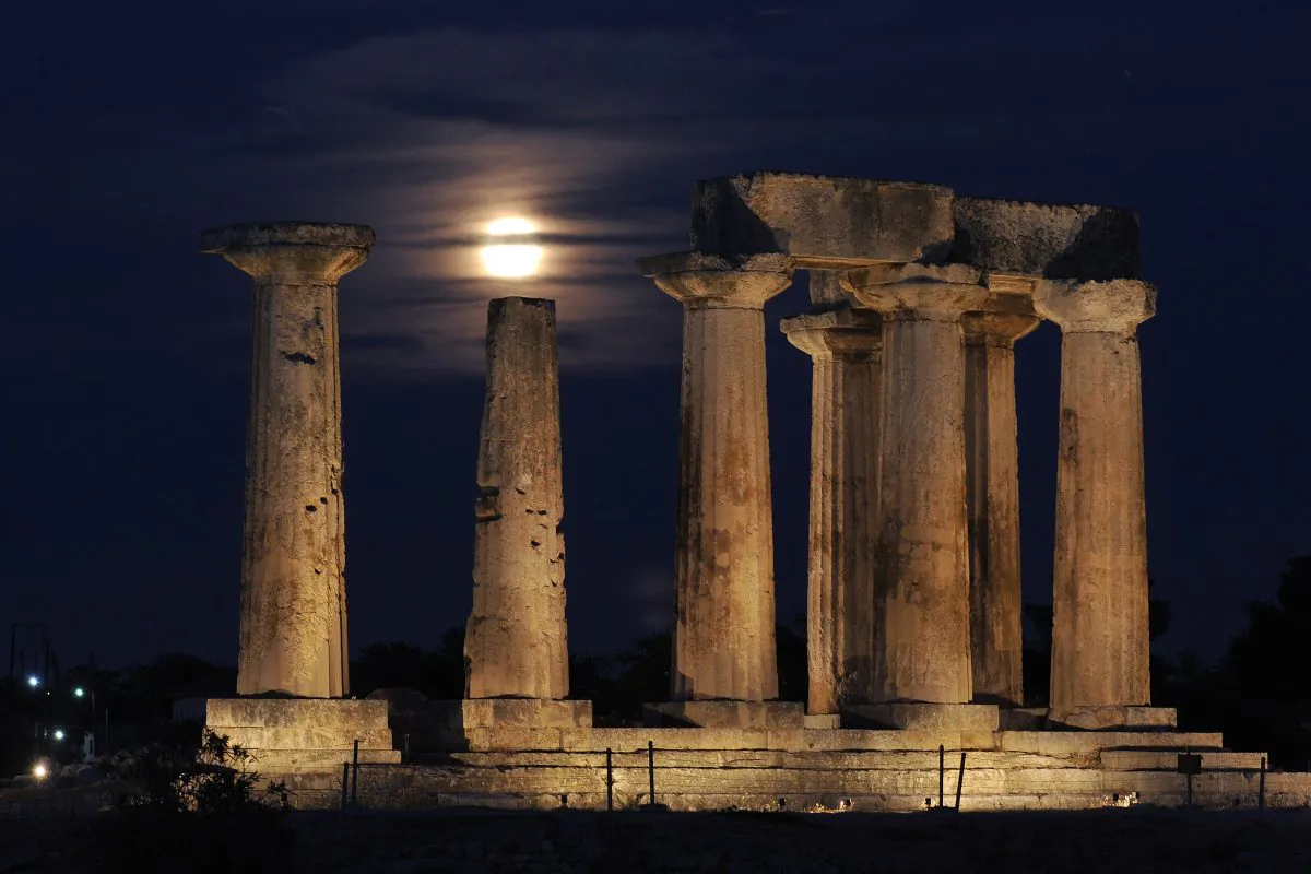 A full moon rises behind the Temple of Apollo in Ancient Corinth on Aug. 21, 2013. (Valerie Gache/AFP/Getty Images)