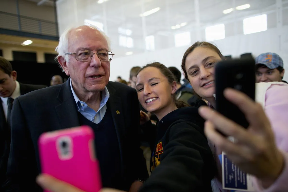 Democratic presidential candidate Sen. Bernie Sanders (I-Vt.) takes a selfie with young supporters at a campaign event in Iowa Falls, Iowa, on Jan. 25, 2016. (AP Photo/Jae C. Hong)