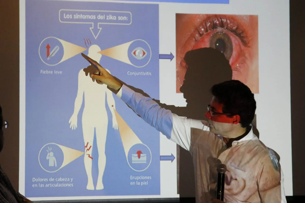 Colombia's Health Minister Alejandro Gaviria explains the symptoms of Zika during an event to launch a nationwide prevention campaign against the virus in Ibague, Colombia, Tuesday, Jan. 26, 2016. Gaviria said the mosquito-borne Zika virus has already infected more than 16,000 people in Colombia and could hit more than half a million throughout the country. (AP Photo/Fernando Vergara)