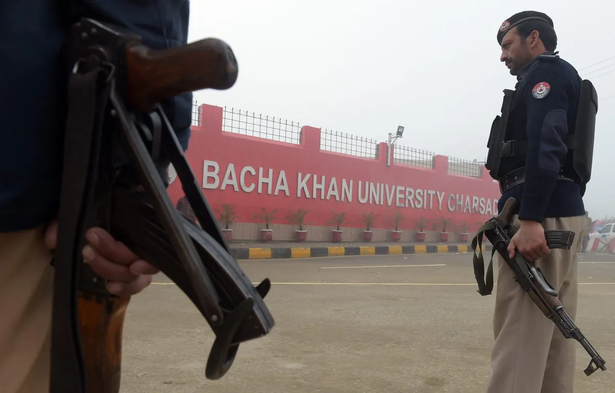 A Pakistani policeman stands guard in front of a school in Peshawar on Jan. 21, 2016, a day after militant attack on Bacha Khan University. (Hasham Ahmed/AFP/Getty Images)