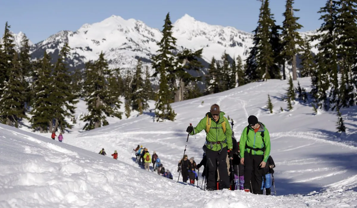 Eric Gullickson, front left, an avalanche instructor with the Northwest Avalanche Center, leads teenagers on an avalanche awareness field trip at Mount Baker, Wash., on Jan. 11, 2016. (Elaine Thompson/AP Photo)