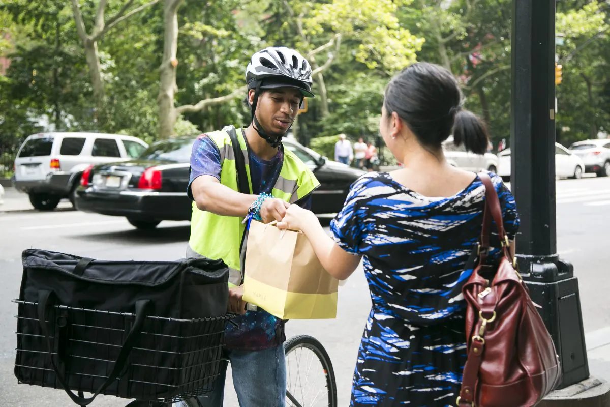 Isaiah delivers food from Maple, a meal delivery service, in the Financial District in Manhattan, New York, on July 20, 2015. (Samira Bouaou/Epoch Times)