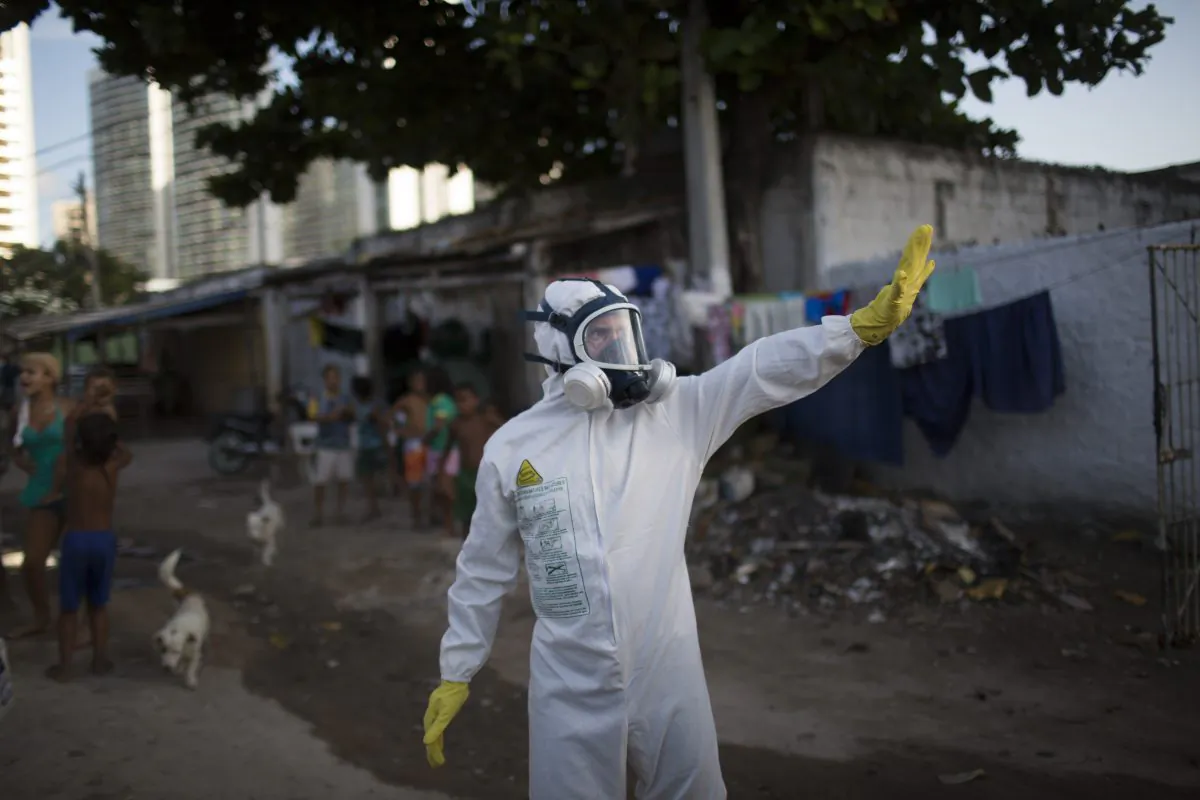 A municipal worker gestures during an operation to combat the Aedes aegypti mosquitoes that transmits the Zika virus in Recife, Pernambuco State, Brazil, on Jan. 26, 2016. (AP Photo/Felipe Dana)