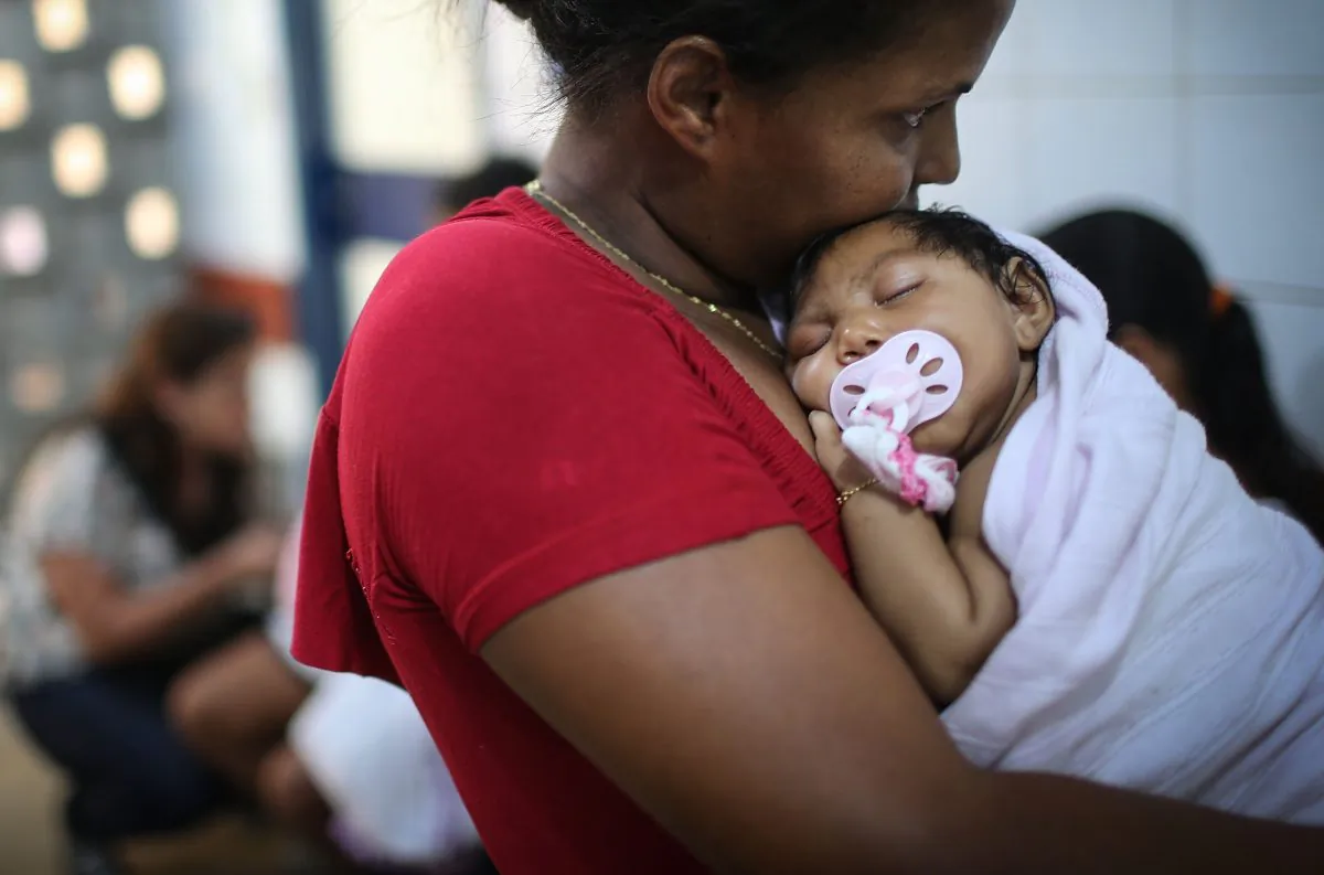 Grandmother Ivalda Caetano holds Ludmilla Hadassa Dias de Vasconcelos (2 months), who has microcephaly, at Oswald Cruz Hospital in Recife, Brazil, on Jan. 26, 2016. (Mario Tama/Getty Images)