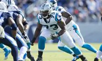 Panthers Tackle Michael Oher Posts Picture With Adoptive Parents on Field After Carolina Win