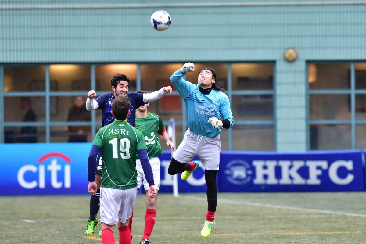 USRC goalkeeper punches clear during their 1-nil defeat by Wanderers in the Yau Yee League, Division 1, at Sports Road on Sunday Jan 24, 2016. (Bill Cox/Epoch Times)