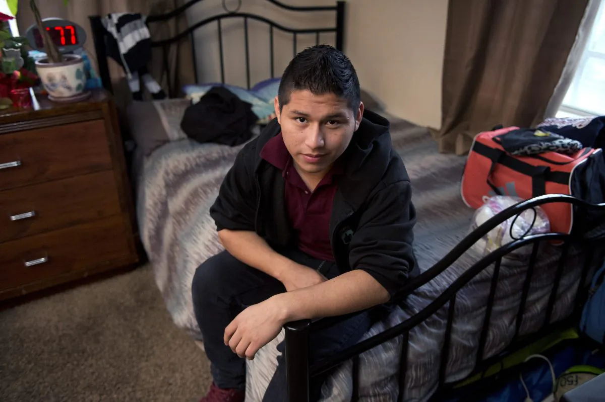 Marvin Velasco, 15, poses at his new home in Los Angeles on Monday, Jan. 11, 2016. (AP Photo/Mark J. Terrill)