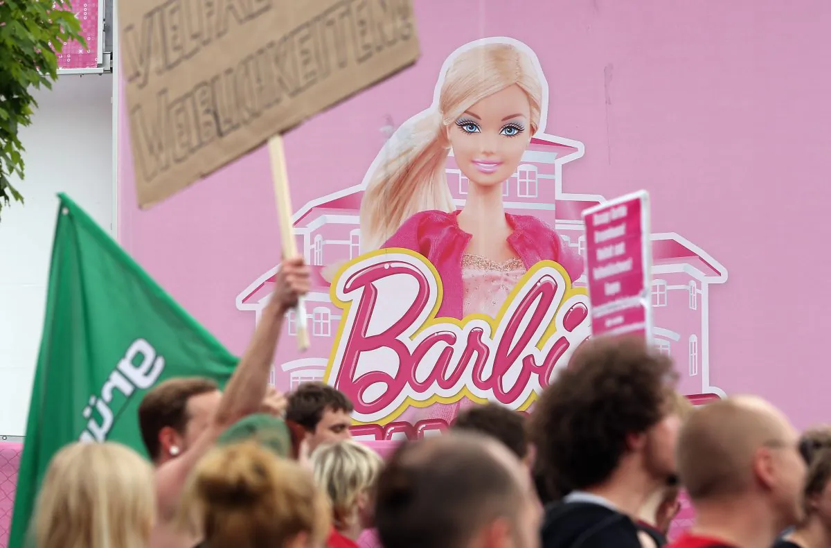 Protesters demonstrating against the social implications of Barbie arrive at the the Barbie Dreamhouse Experience on May 16, 2013 in Berlin, Germany. (Sean Gallup/Getty Images)