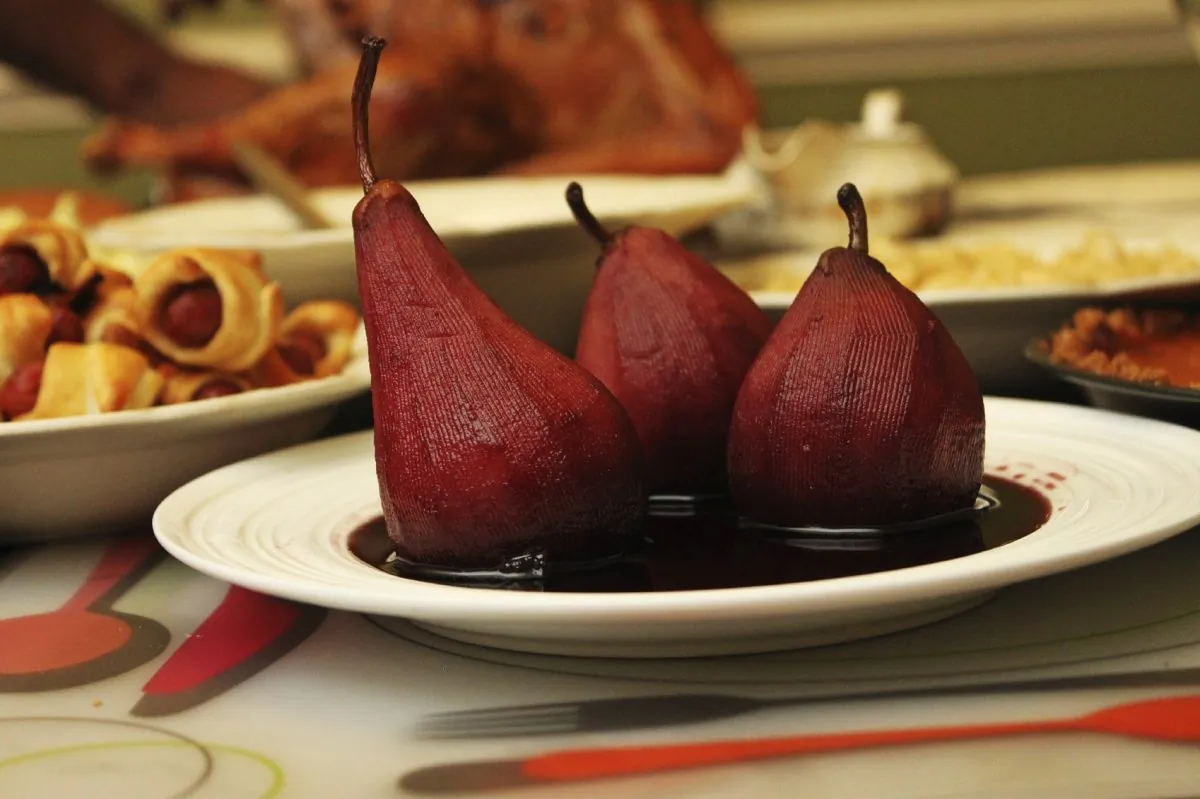 Pears cooked in red wine with a ginger and sherry sauce. (vm2002/iStock) 