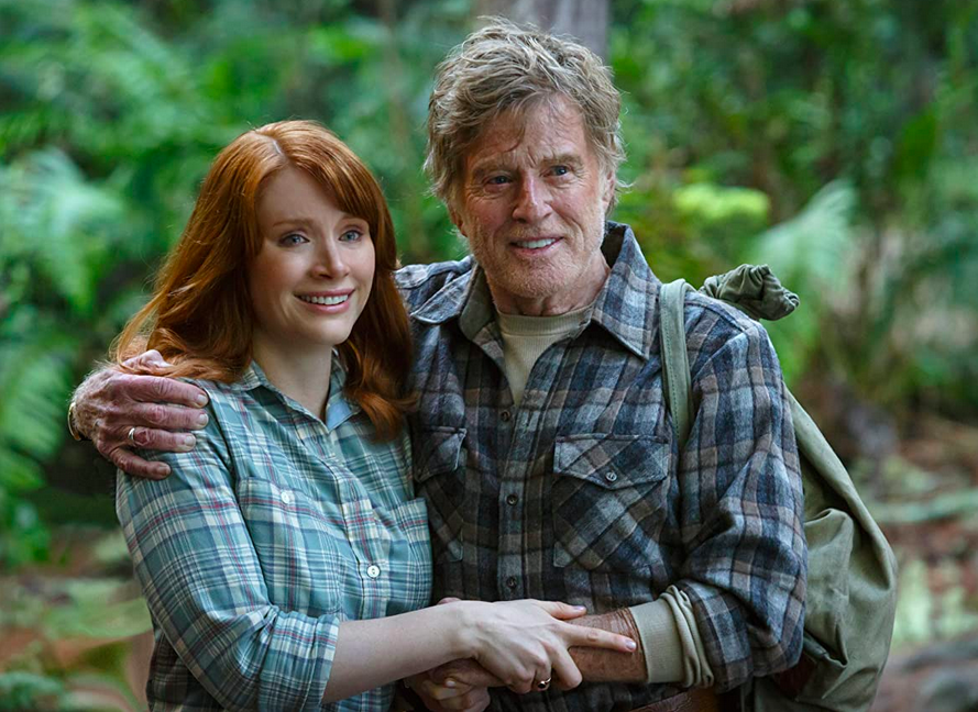 man and woman in plaid shirts in Pete's dragon