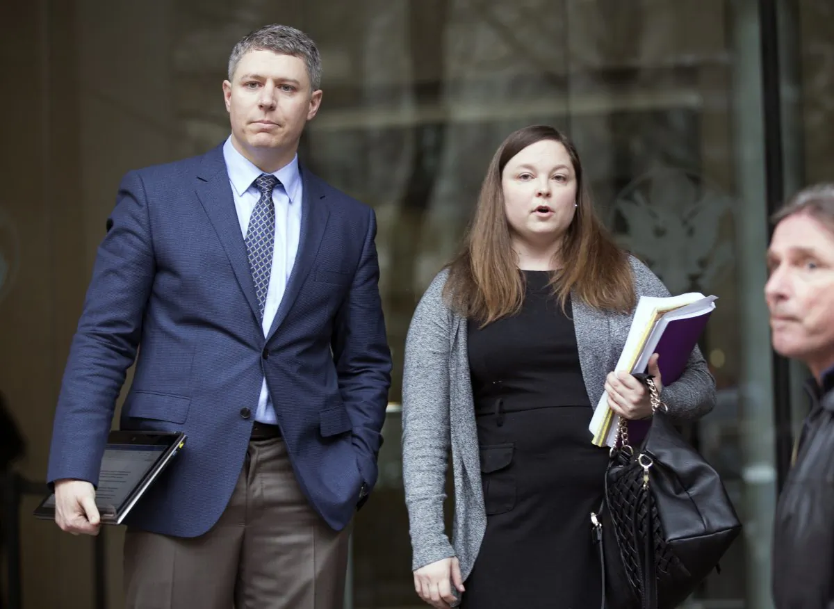 Mike Arnold (L) and Lissa Casey (R), representing Ammon Bundy, spoke briefly after Bundy's appearance in the Mark O. Hatfield U.S. Courthouse in Portland, Ore., on Jan. 27, 2016. (Kristyna Wentz-Graff/The Oregonian via AP)