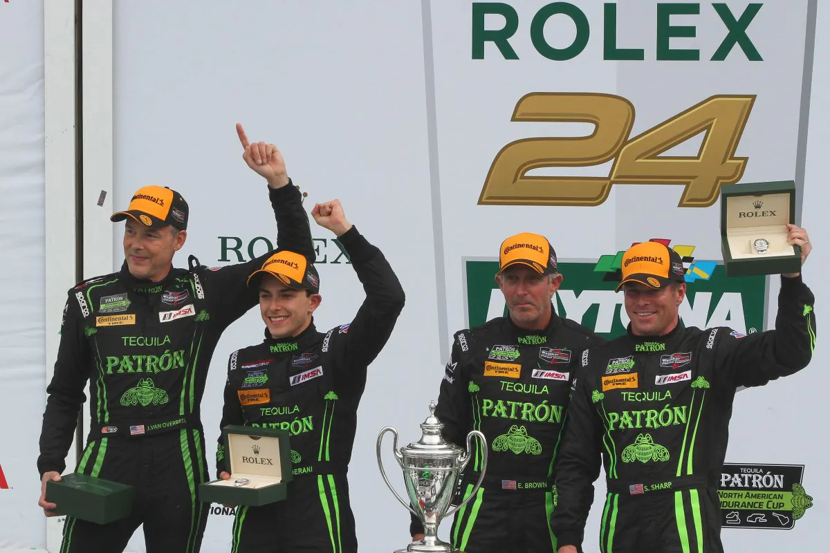 Johannes van Overbeek, Pipo Derani, Ed Brown, and Scott Sharp display the Rolex watches they earned by winning the 2016 WeratherTech SportsCar Championship Rolex 24 at Daytona. (Chris Jasurek/Epoch Times)