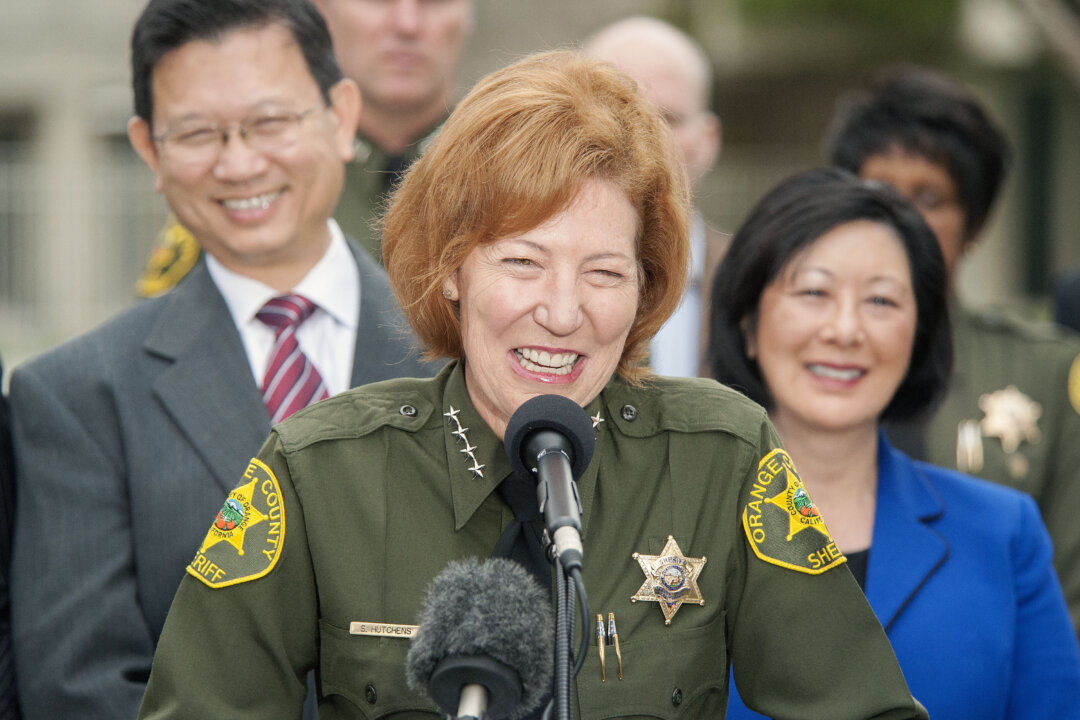 Orange County Sheriff Sandra Hutchens is all smiles as she answers questions during a news conference outside Orange County Sheriff's Department headquarters in Santa Ana on Jan. 30, 2016. (Ken Steinhardt/The Orange County Register via AP)