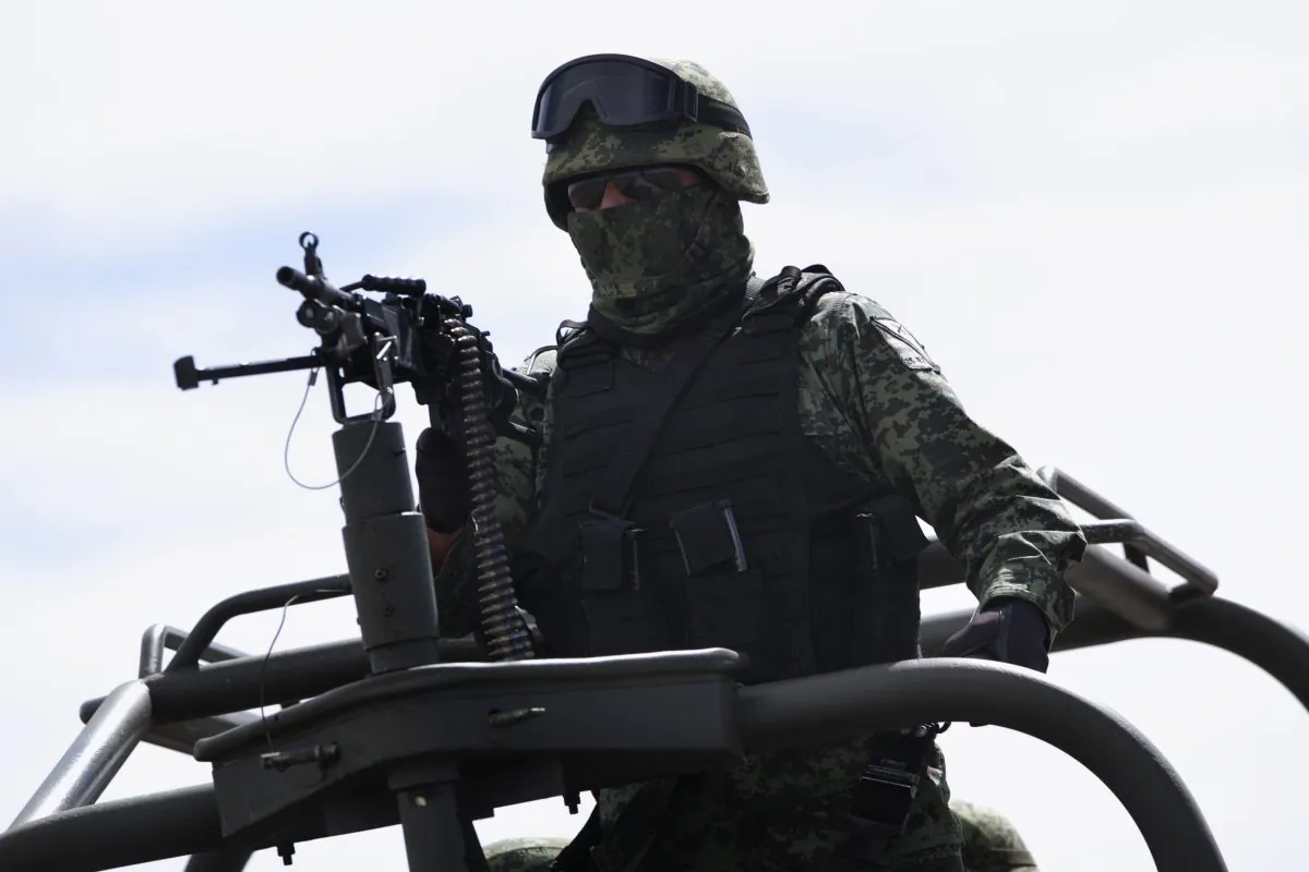 A soldier patrols on the perimeters of the Altiplano maximum security prison in Almoloya, west of Mexico City, on Jan. 9, 2016, where Joaquin "El Chapo" Guzman, head of the Sinaloa Cartel, is being held after his recaptur. (AP Photo/Marco Ugarte)