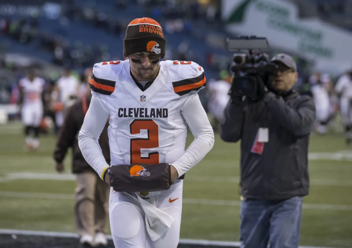 Quarterback Johnny Manziel of the Cleveland Browns has made more news off the field than on it in his two years in the league. (Stephen Brashear/Getty Images) 