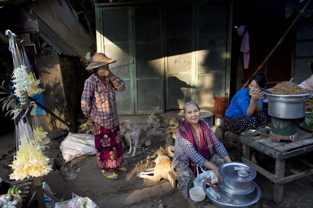 Street hawkers wait for customers in Yangon, Myanmar, on Jan. 30, 2016. (AP Photo/ Gemunu Amarasinghe)
