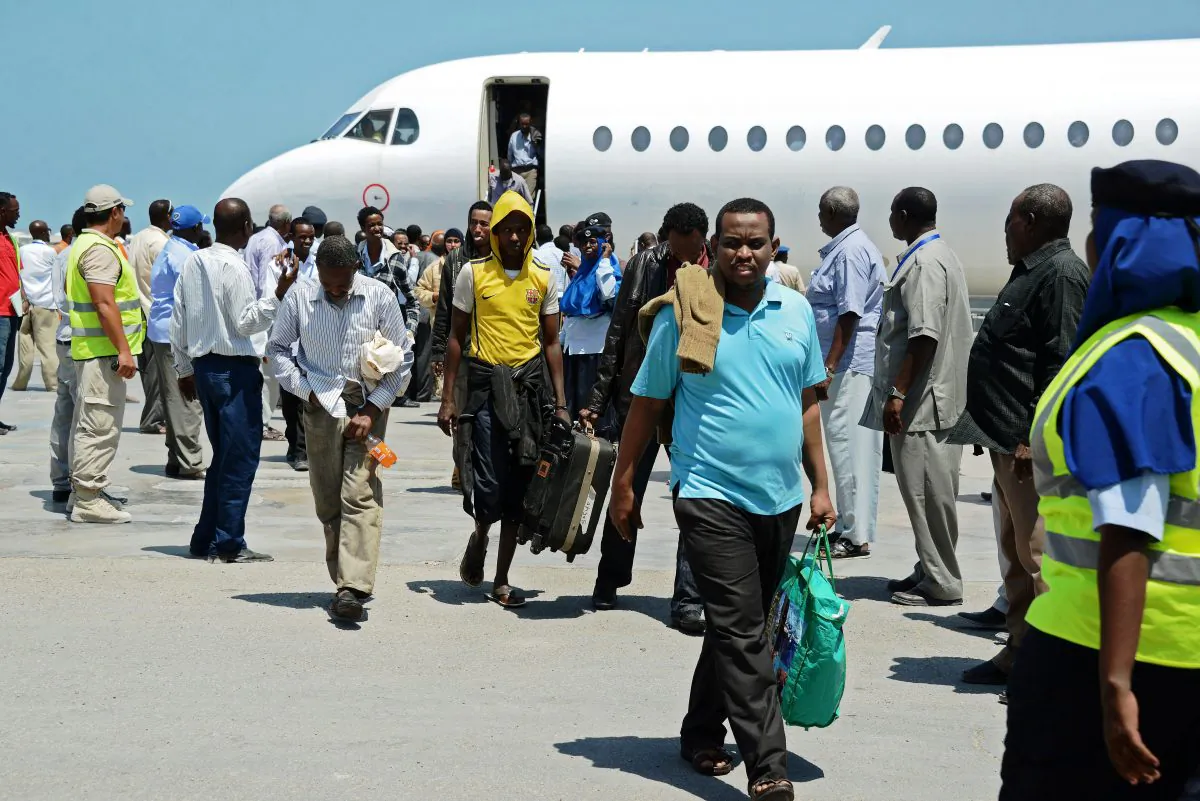 Somali refugees, deported from Kenya, arrive at Mogadishu's Airport, on April, 9, 2014. (Mohamed Abdiwahab/AFP/Getty Images)