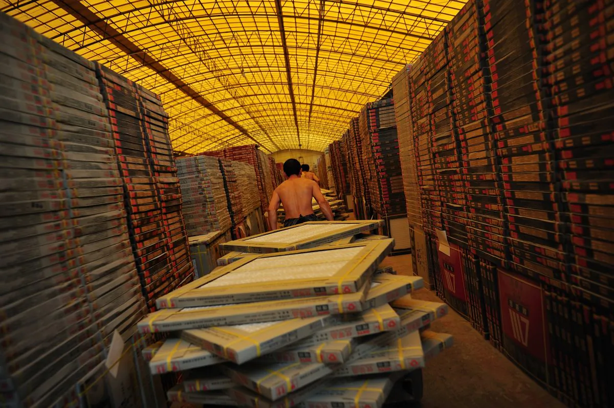 A worker drags tiles in a tile factory in Foshan of Guangdong Province on Sept. 26, 2008. Construction materials from China have been found to be hazardous. (China Photos/Getty Images).
