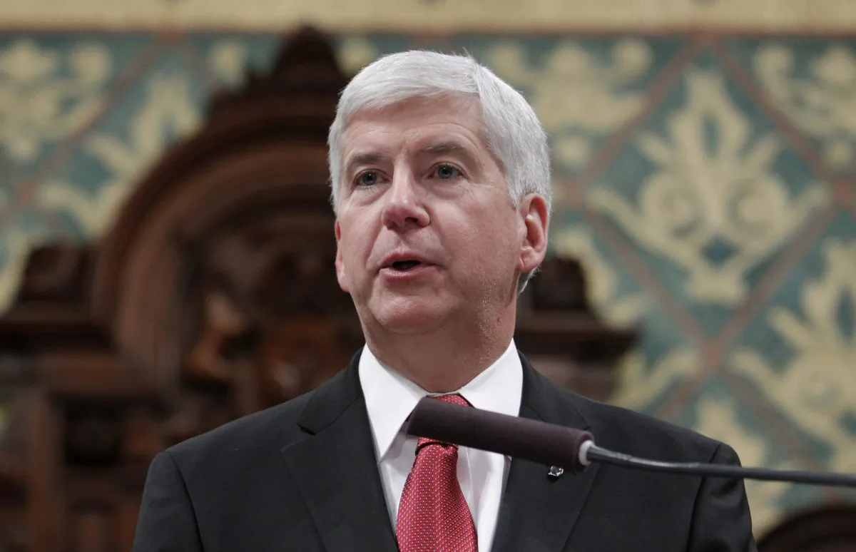 Michigan Gov. Rick Snyder delivers his State of the State address to a joint session of the House and Senate, at the state Capitol in Lansing, Mich., on Jan. 19, 2016. (AP Photo/Al Goldis)