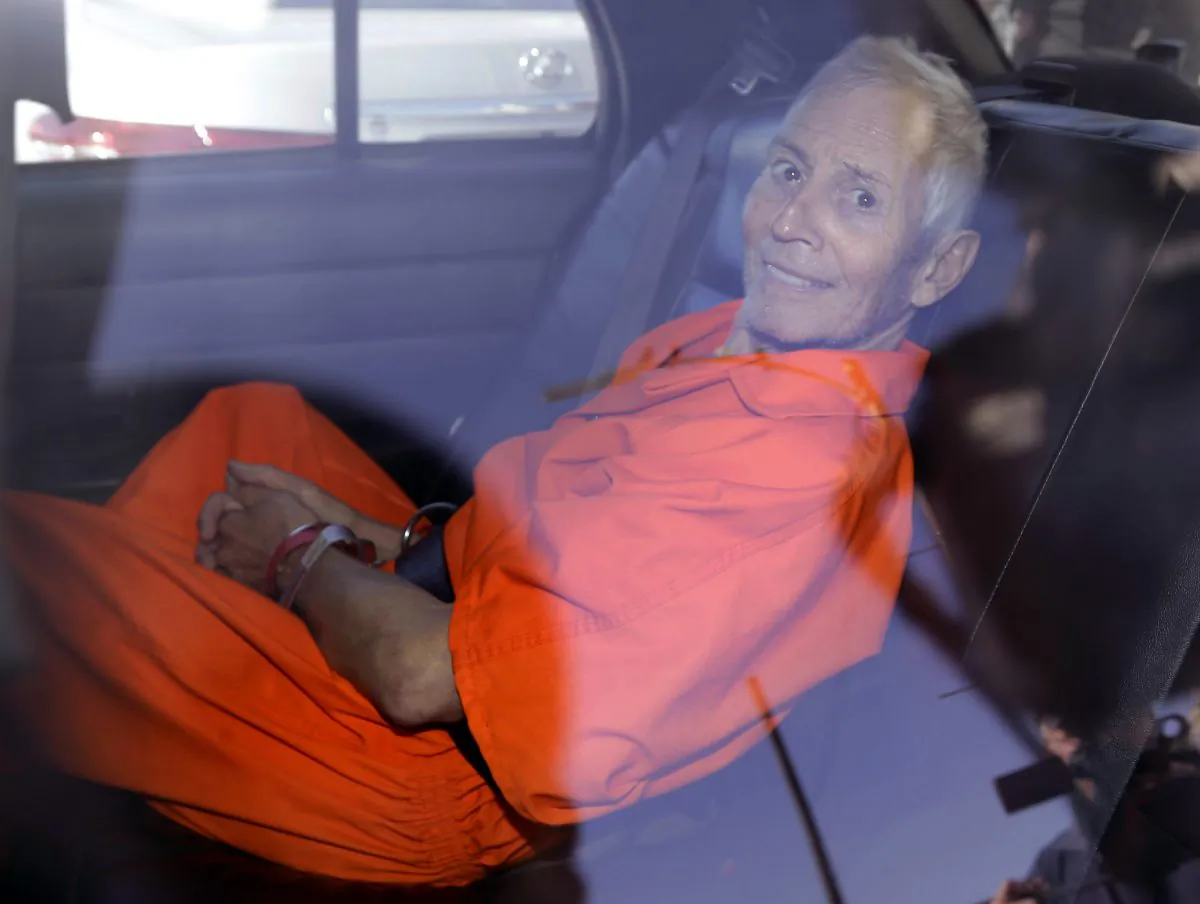Robert Durst is transported from Orleans Parish Criminal District Court to the Orleans Parish Prison after his arraignment on murder charges in New Orleans on March 17, 2015. U.S. District Judge Kurt Engelhardt has scheduled Durst’s re-arraignment for Wednesday, Feb. 3, 2016, on a charge of illegally carrying a .38-caliber revolver after a felony conviction. (AP Photo/Gerald Herbert)